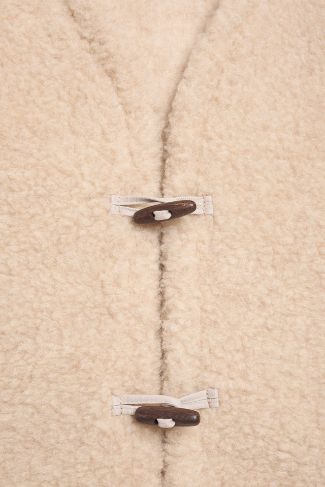 wełniana kamizelka merino bezowa almond z guzikiem merino wool vest beige 
