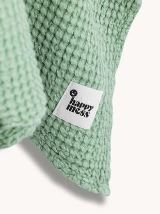 ponczo waflowe dzieciece lniane kąpielowe poncho sage zielone detal logo