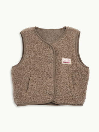 dziecięca wełniana kamizelka merino hazelnut beżowa wool vest gilet slevless przód