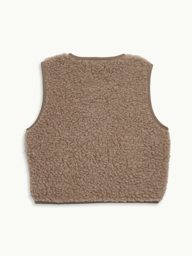 dziecięca wełniana kamizelka merino hazelnut beżowa wool vest gilet slevless tył