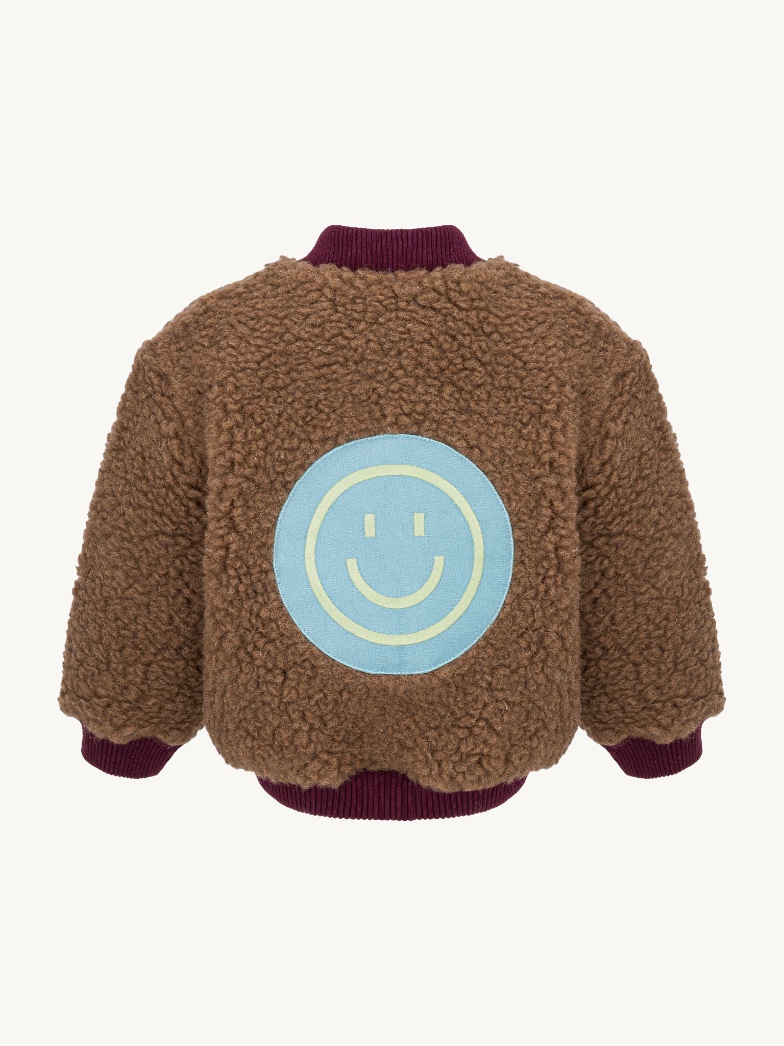 kurtka dziecięca bomberka wełniana merino teddy brown tył naszywka uśmiech smile