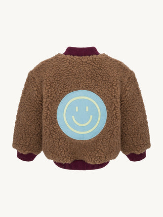 kurtka dziecięca bomberka wełniana merino teddy brown tył naszywka uśmiech smile