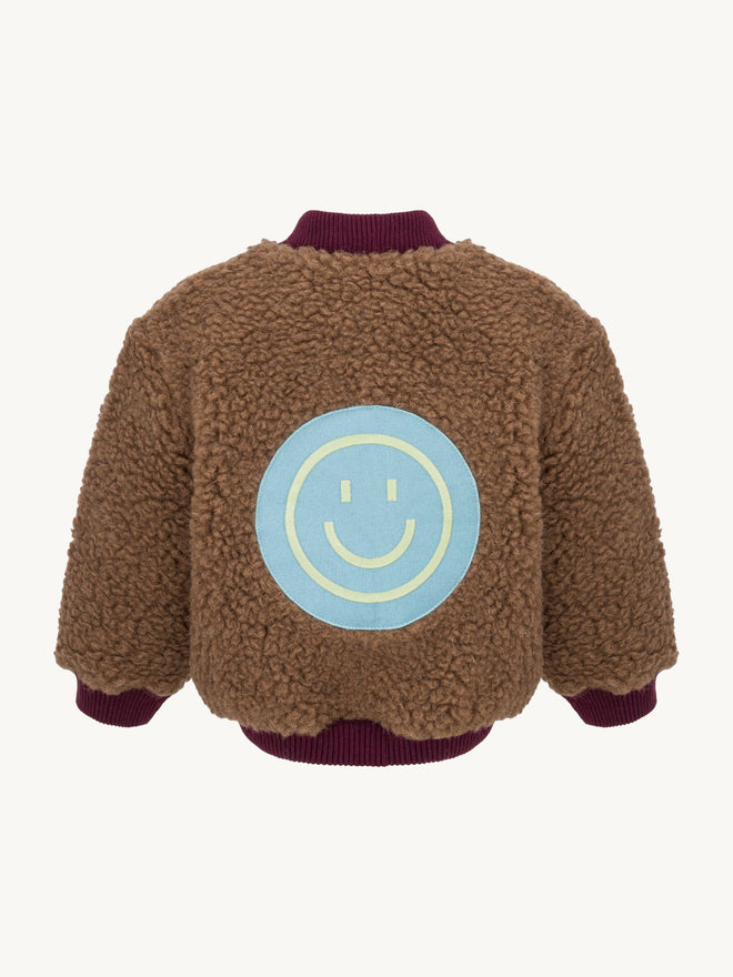 kurtka dziecięca bomberka wełniana merino teddy brown tył naszywka uśmiech smile