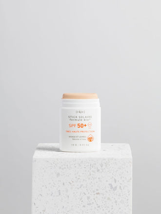 sztyft przeciwsłoneczny spf 50 golden złoty sunscreen stick tło